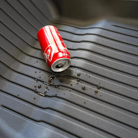 A can of coke spilled out on the TPE material waterproof floor mat. A can of coke spilled out on the TPE material waterproof floor mat.